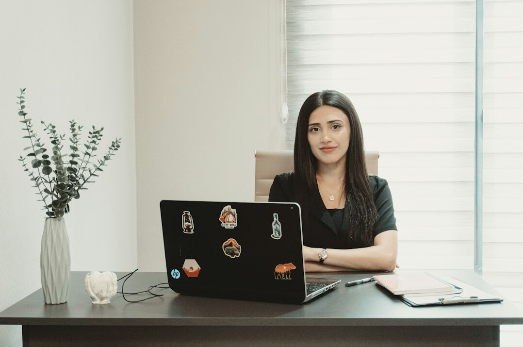 writer at desk with laptop